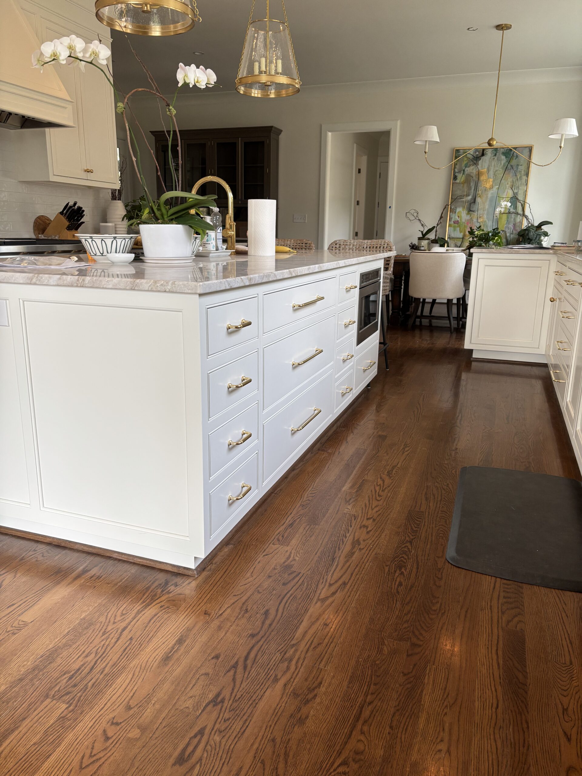 Kitchen with white island and pendant lights