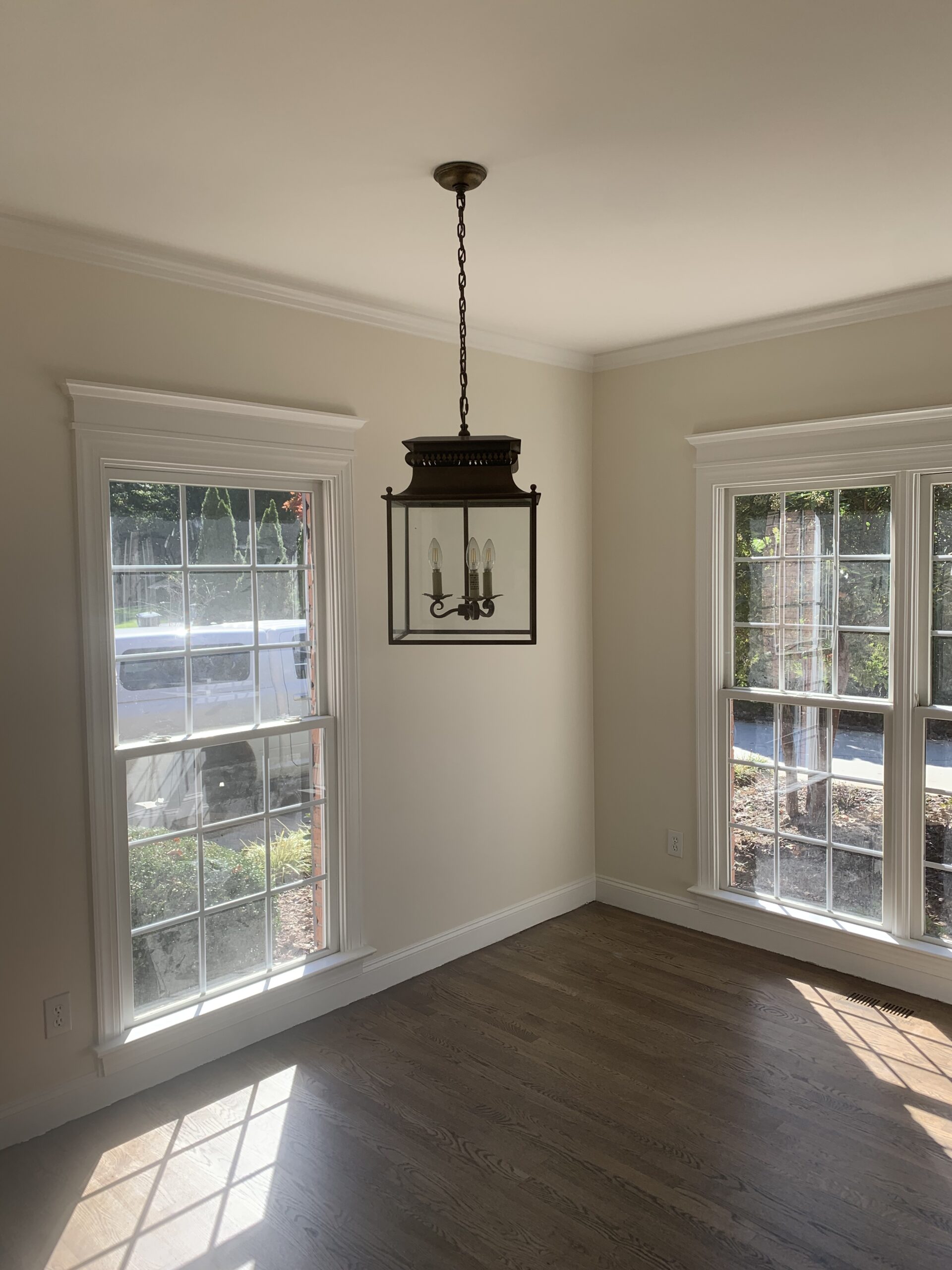 Dining room with lantern pendant light and hardwood floors