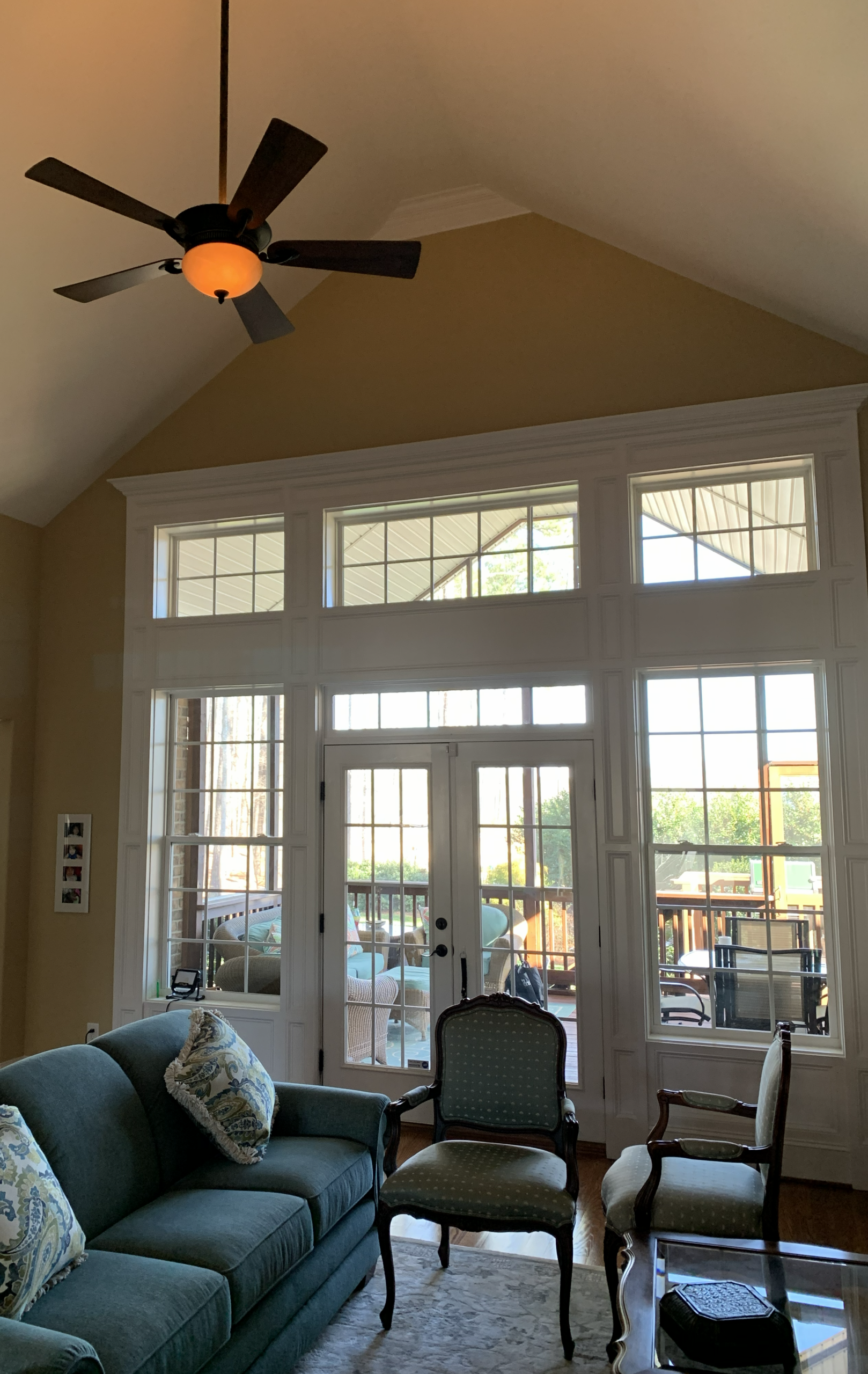 Sunroom with ceiling fan, French doors and seating area
