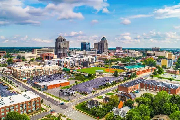 Aerial view of downtown Greensboro and surrounding neighborhoods in Guilford County, NC